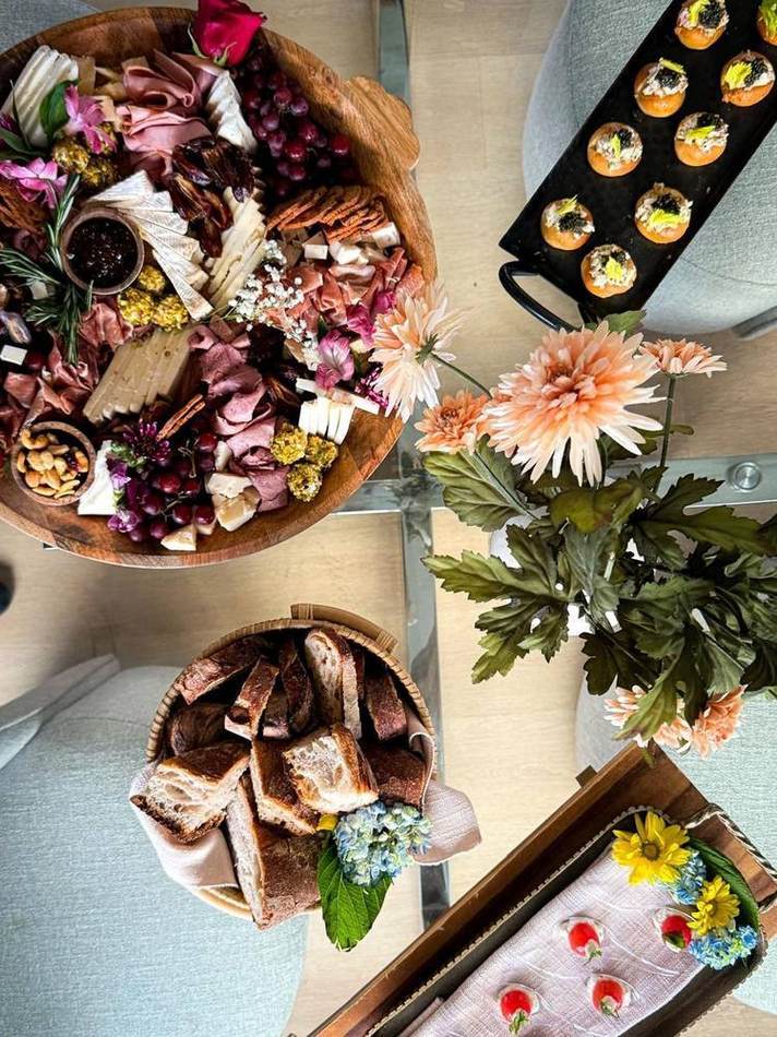 Overhead grazing spread with flowers. Chef Tasos Luxury Dining, Miami