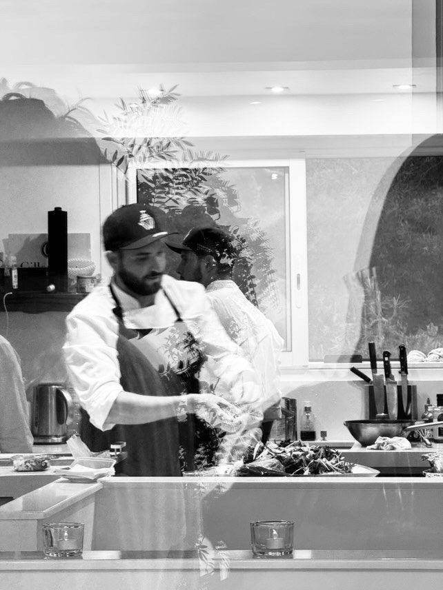 Chef in the kitchen, black & white. Chef Tasos Luxury Dining, Miami