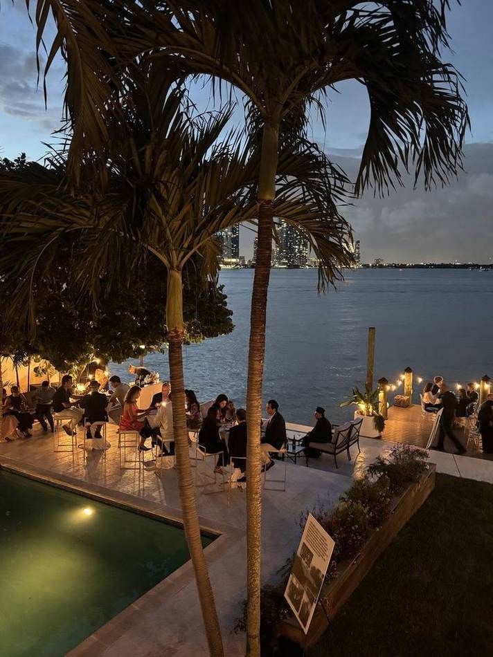 Sunset event, palms and water. Chef Tasos Luxury Dining, Miami