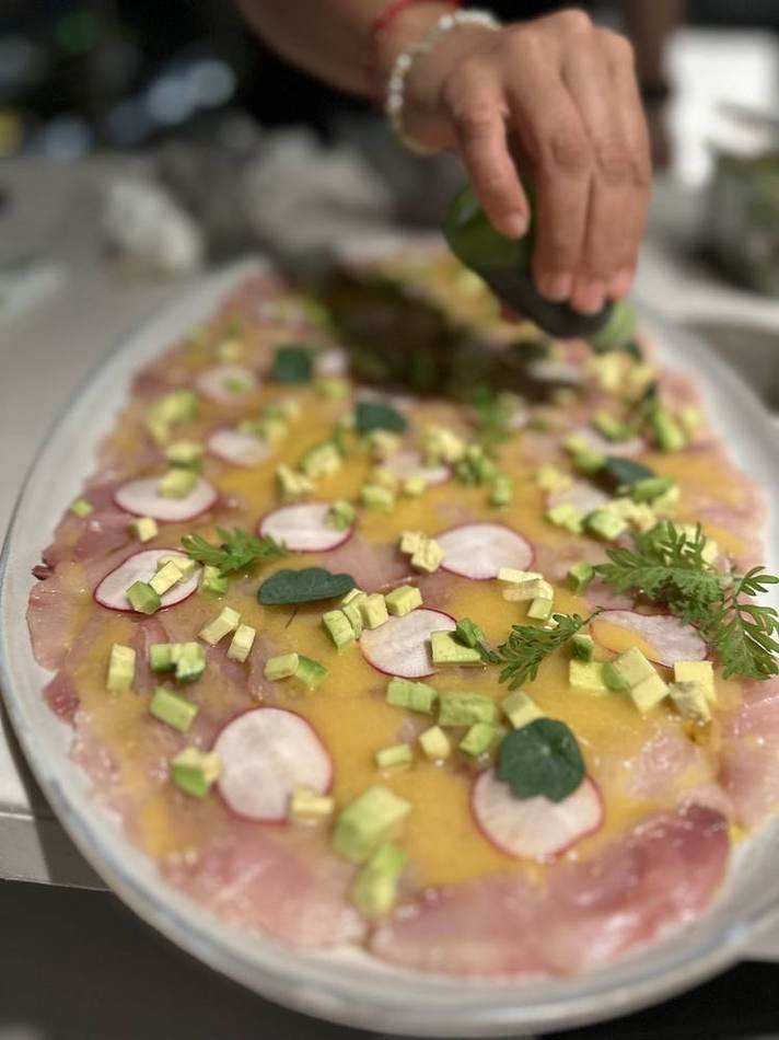 Crudo being dressed. Chef Tasos Luxury Dining, Miami
