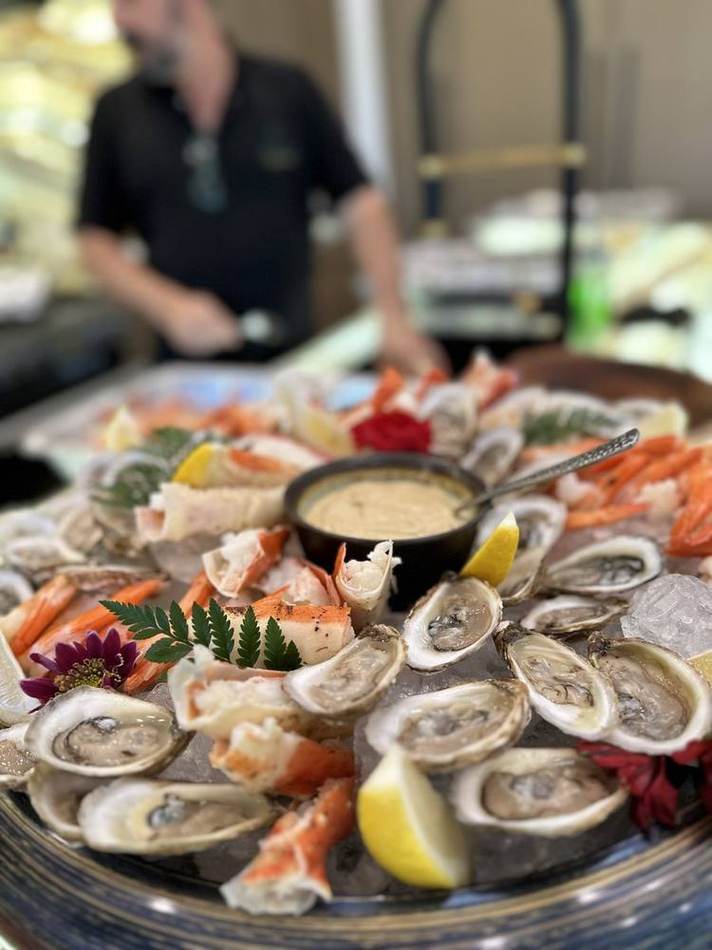 Seafood platter, chef behind. Chef Tasos Luxury Dining, Miami