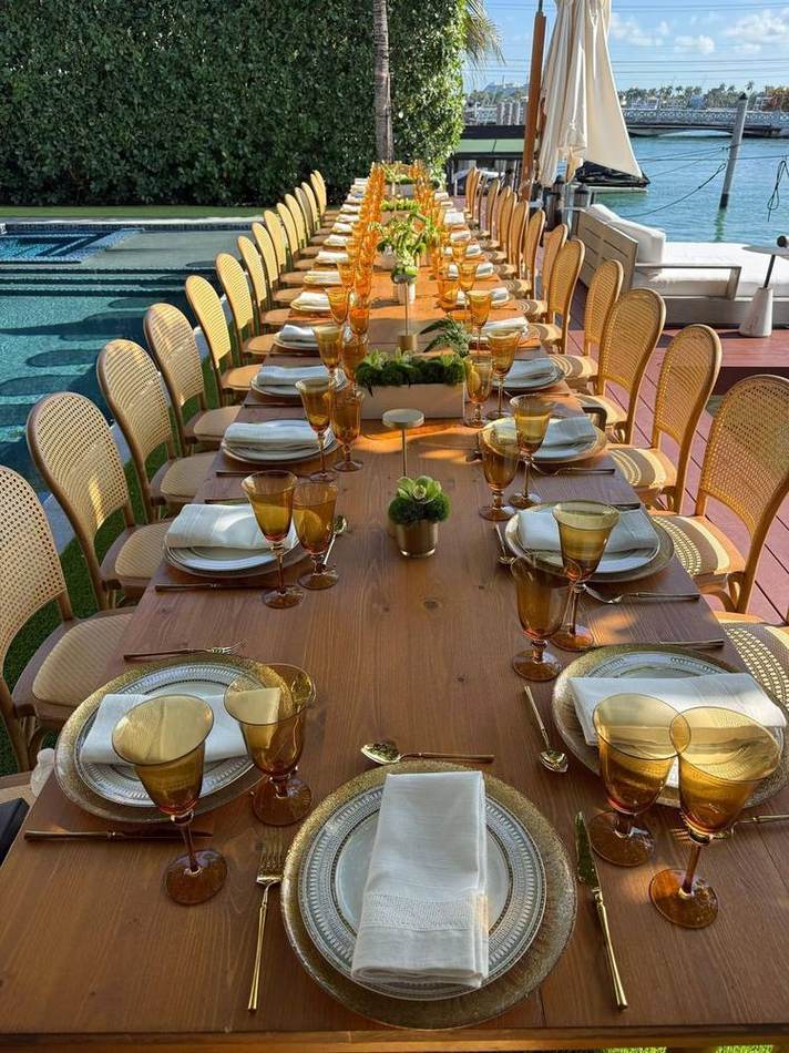 Poolside long table, gold settings. Chef Tasos Luxury Dining, Miami