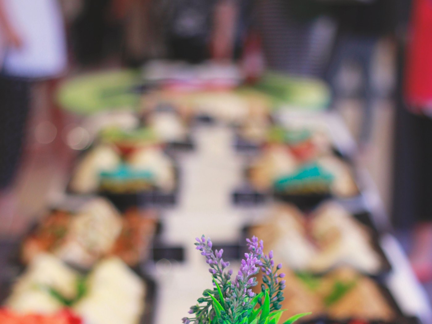 Stacked plates beside a buffet table laid for service