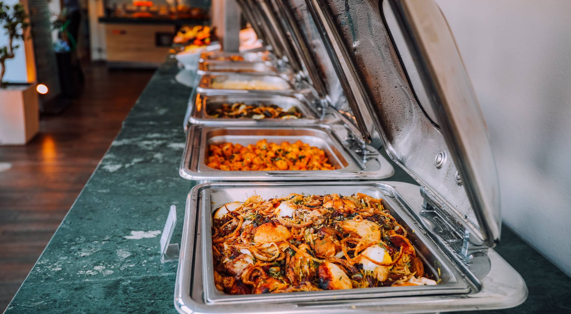 A hot buffet line set up for an office lunch