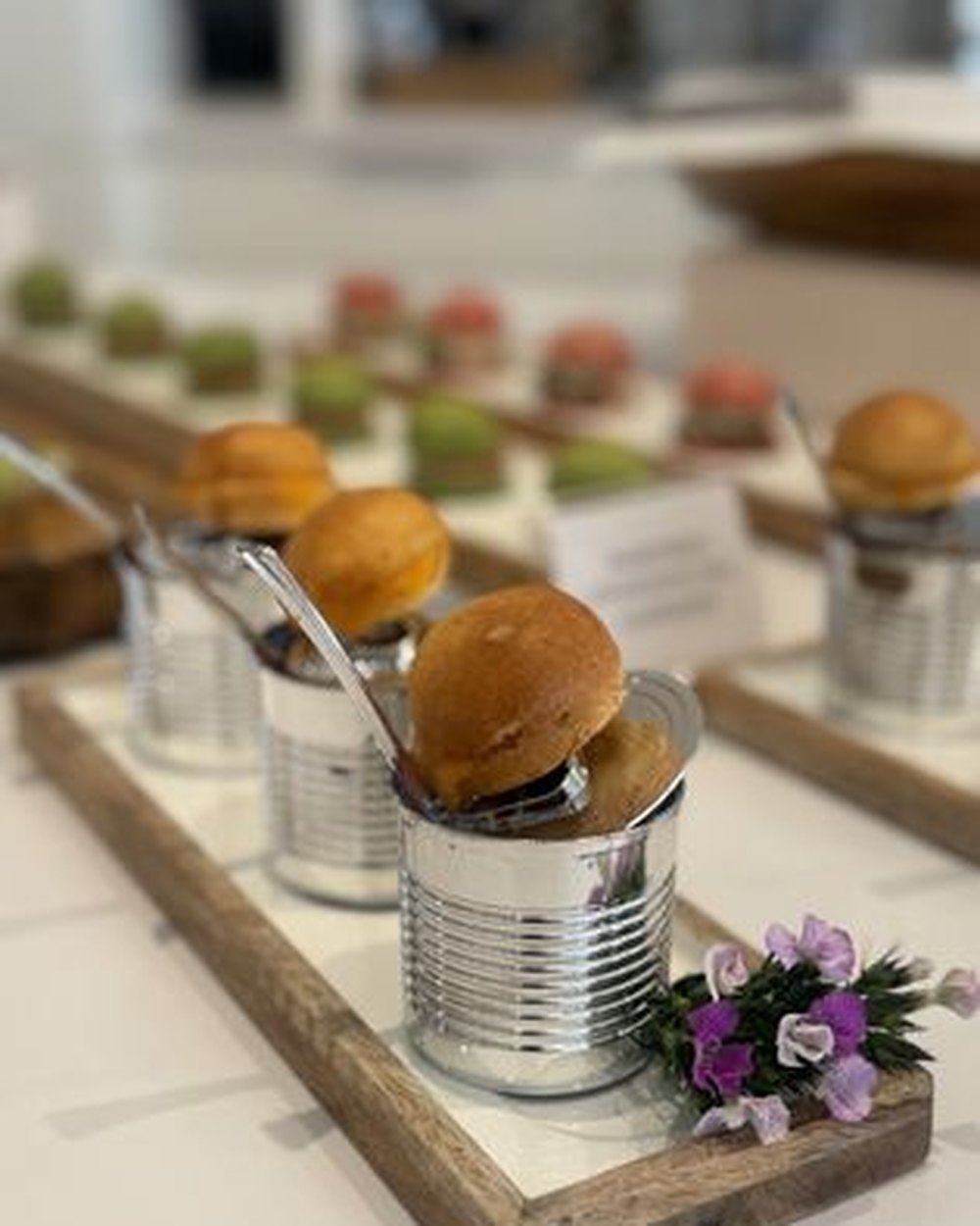 Individually portioned sliders in tins for a team lunch. Chef Tasos Luxury Dining